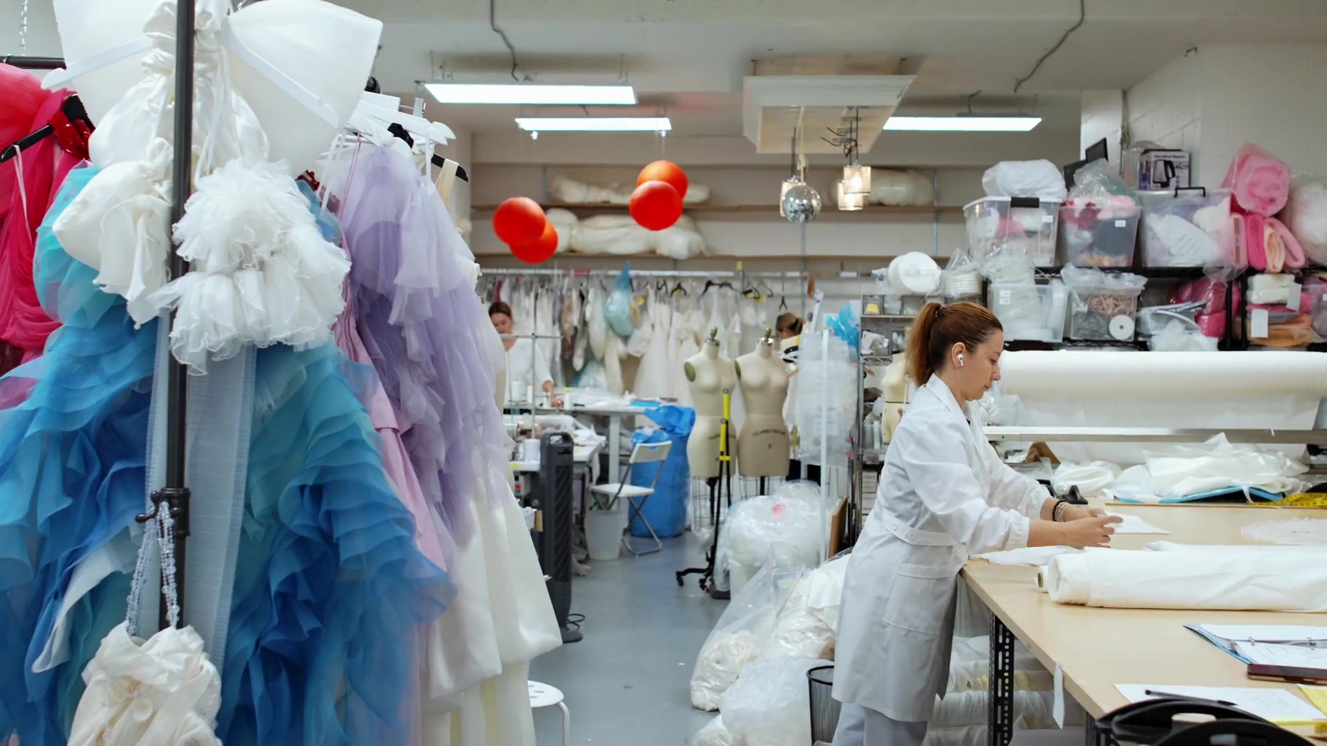 OUMA designer at work inside the Vancouver couture atelier